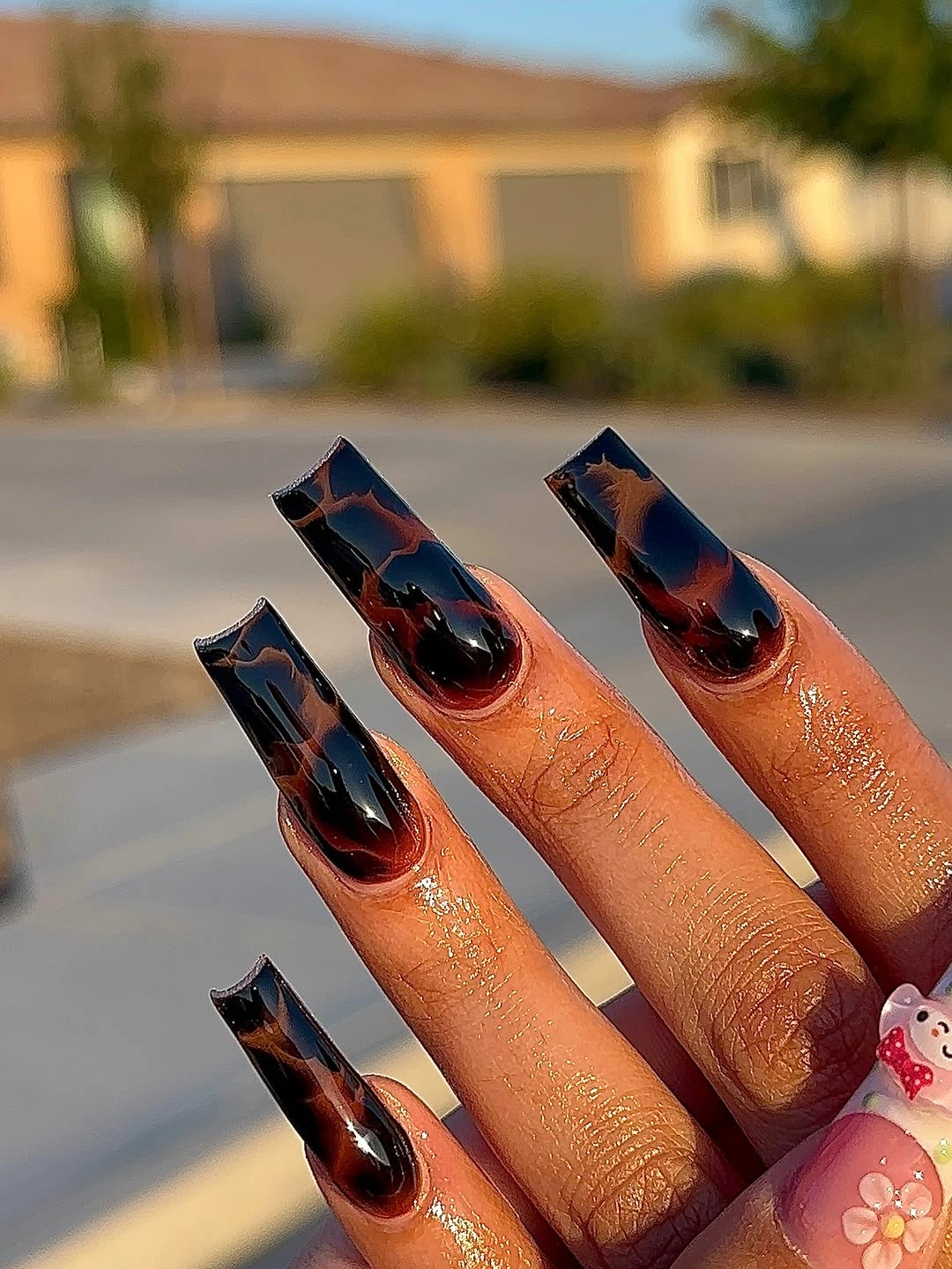 Very long tapered nails with orange and black color blocking