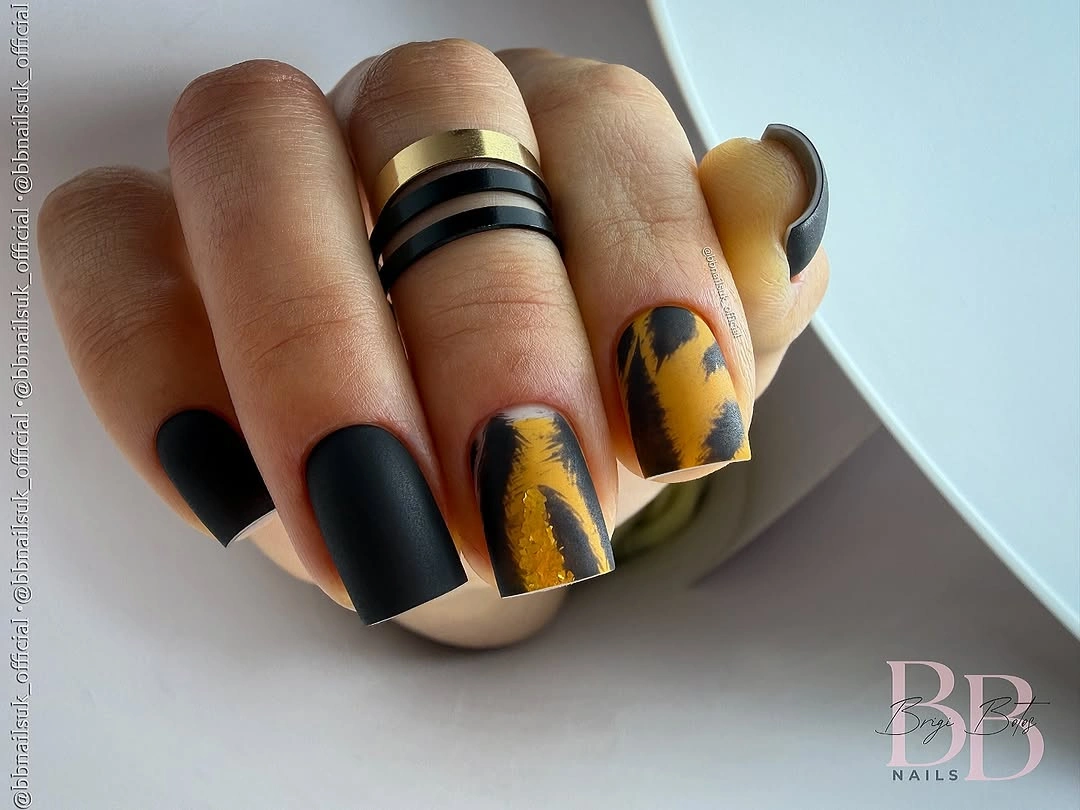 Black matte square nails with mustard abstract accent panels