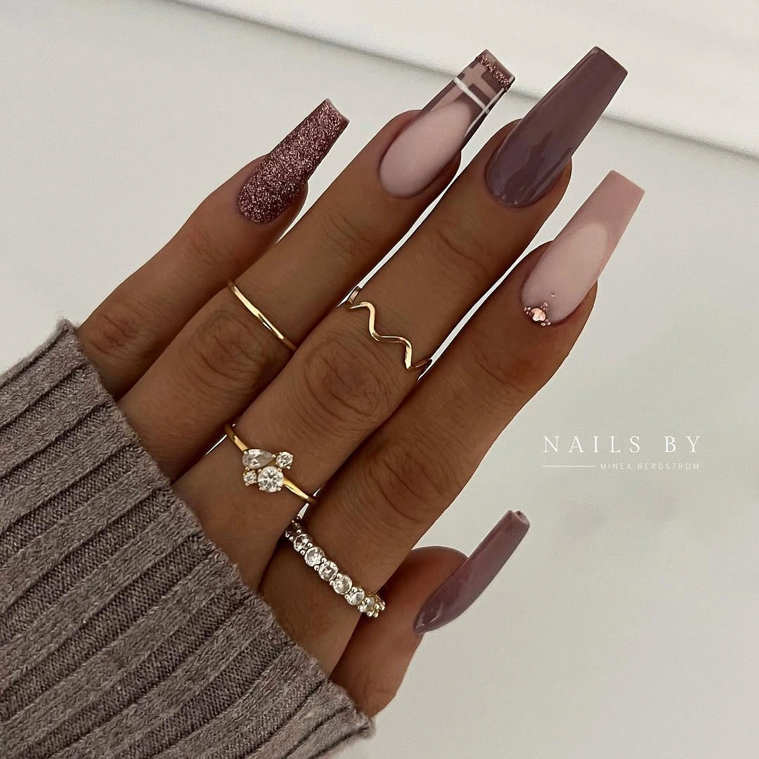 Mauve cocoa and glitter nails with gold line accents
