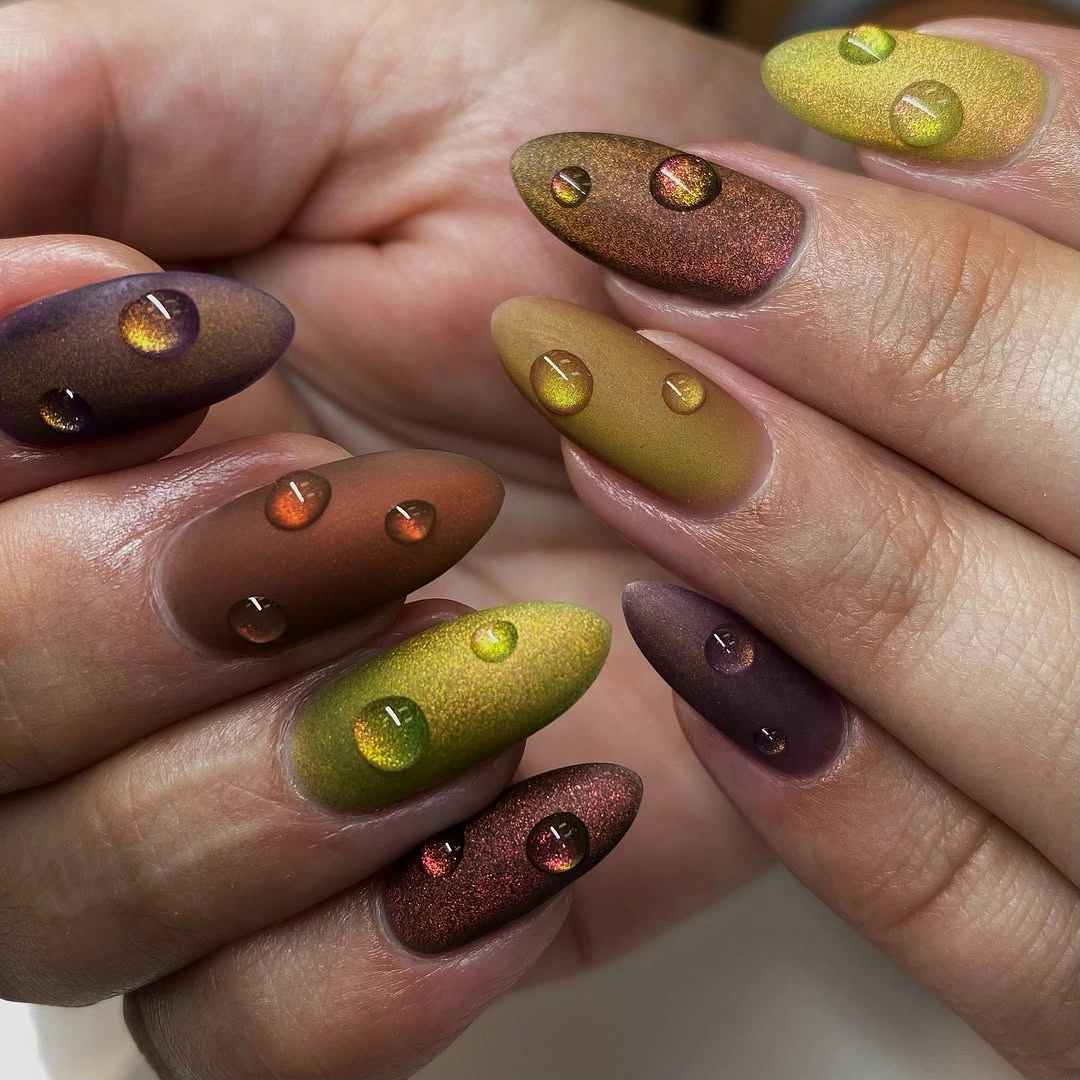 Olive bronze and plum almond nails with dot accents