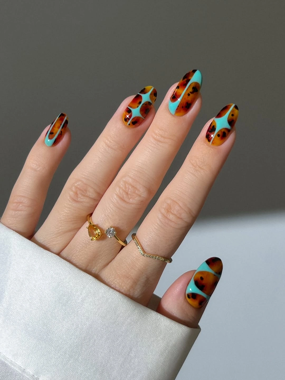 Rust turquoise and black abstract medium almond nails
