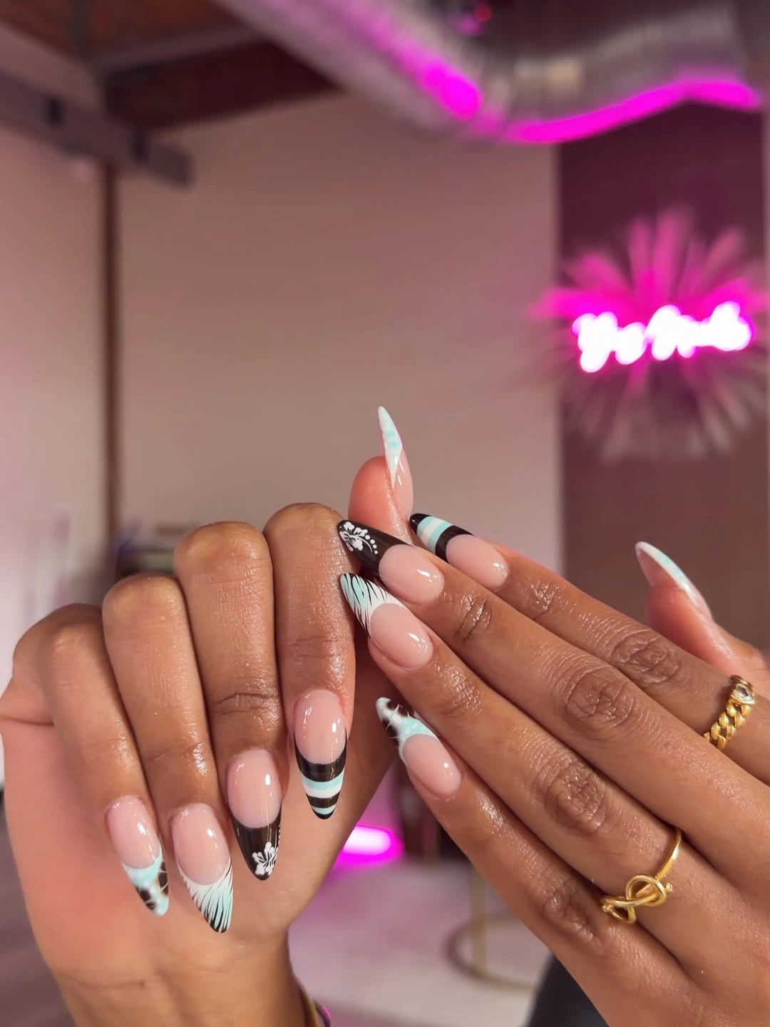 Pink almond nails with mint black and white curved tips
