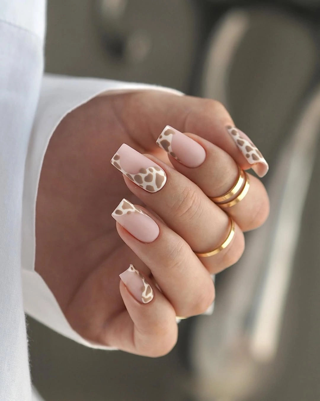 Nude square nails with tan animal spot tips