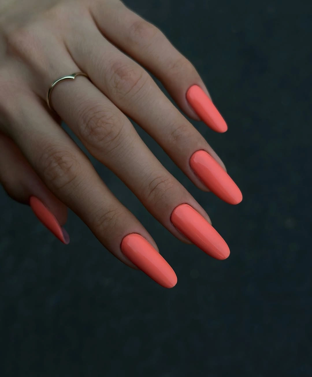 Warm coral almond nails with smooth finish