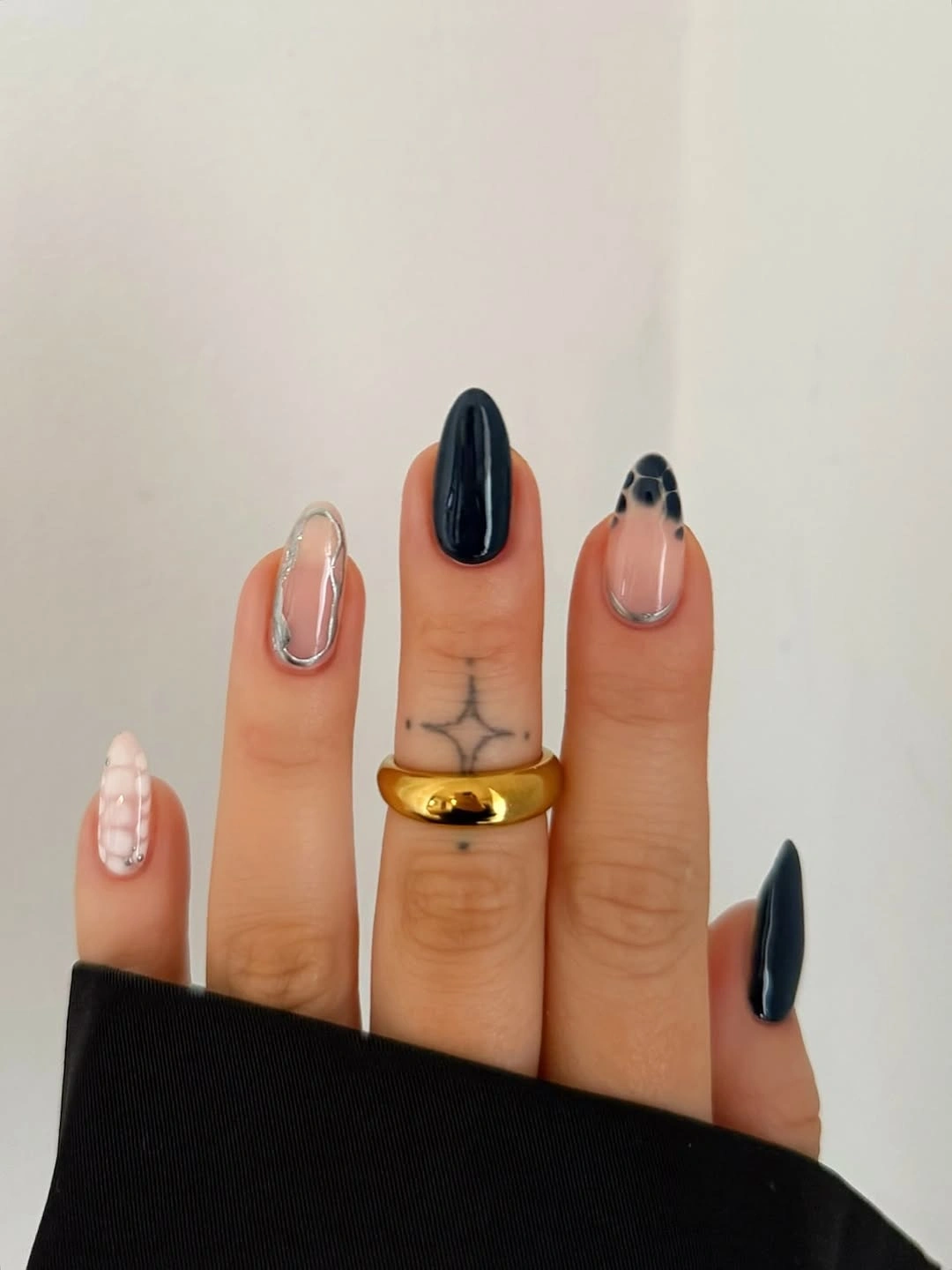 Medium square nails with black solids and white floral accents