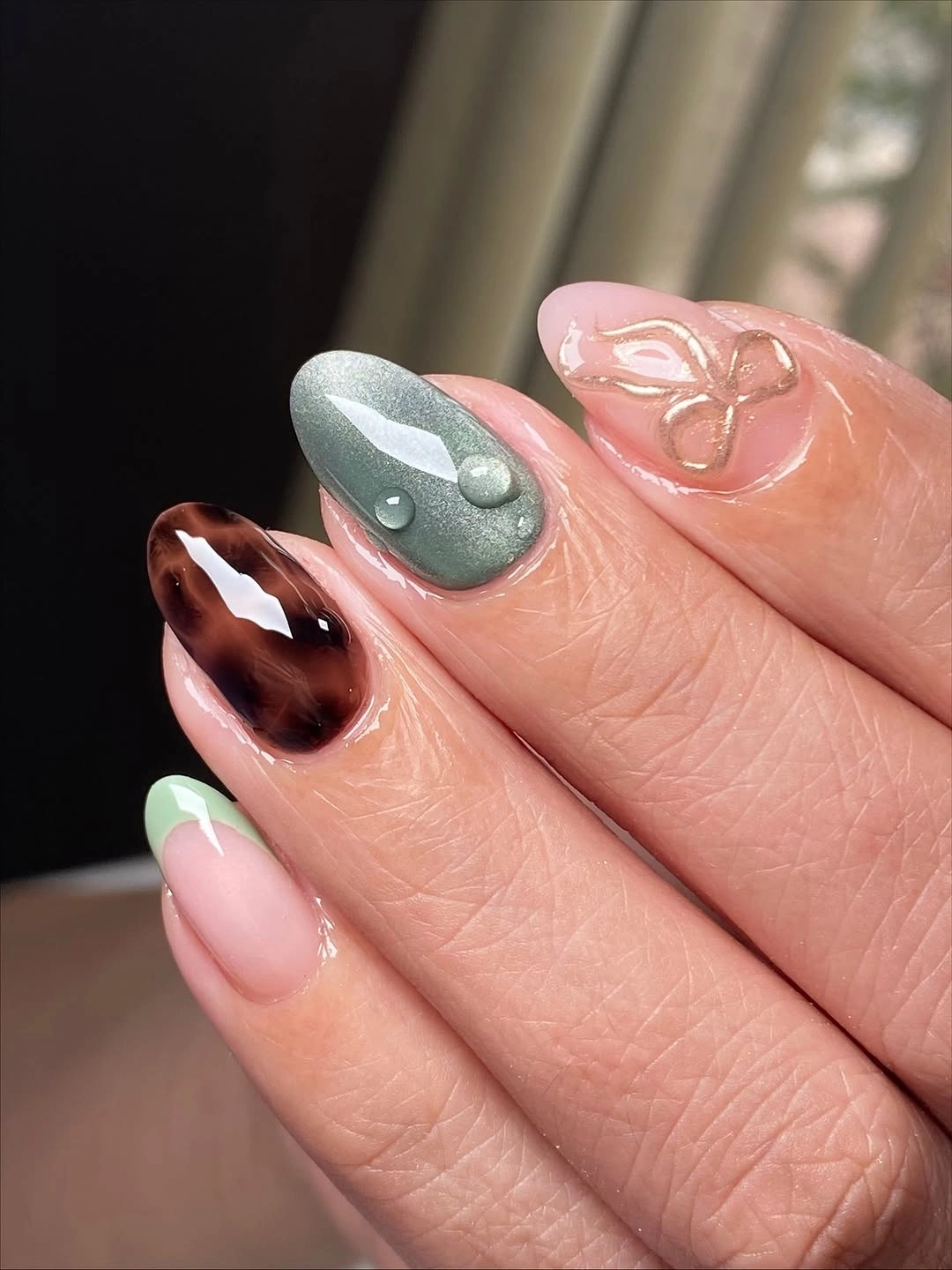 Medium almond brown caramel nails with layered French curves