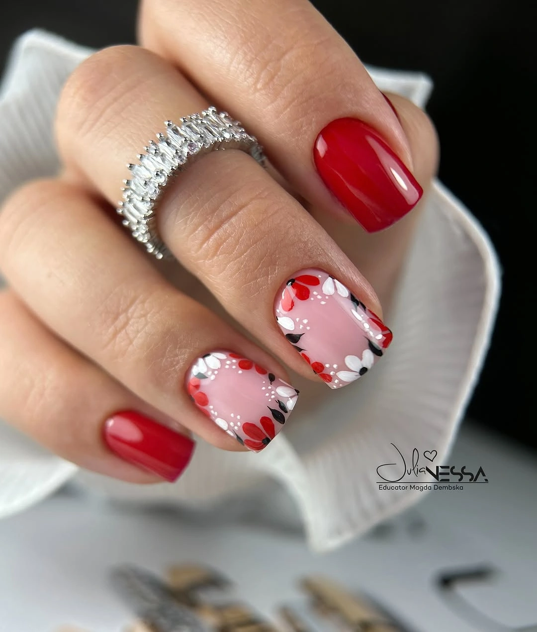 Short red square nails with floral borders