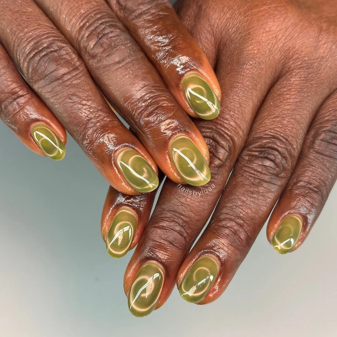 Short olive nails with glossy halo centers