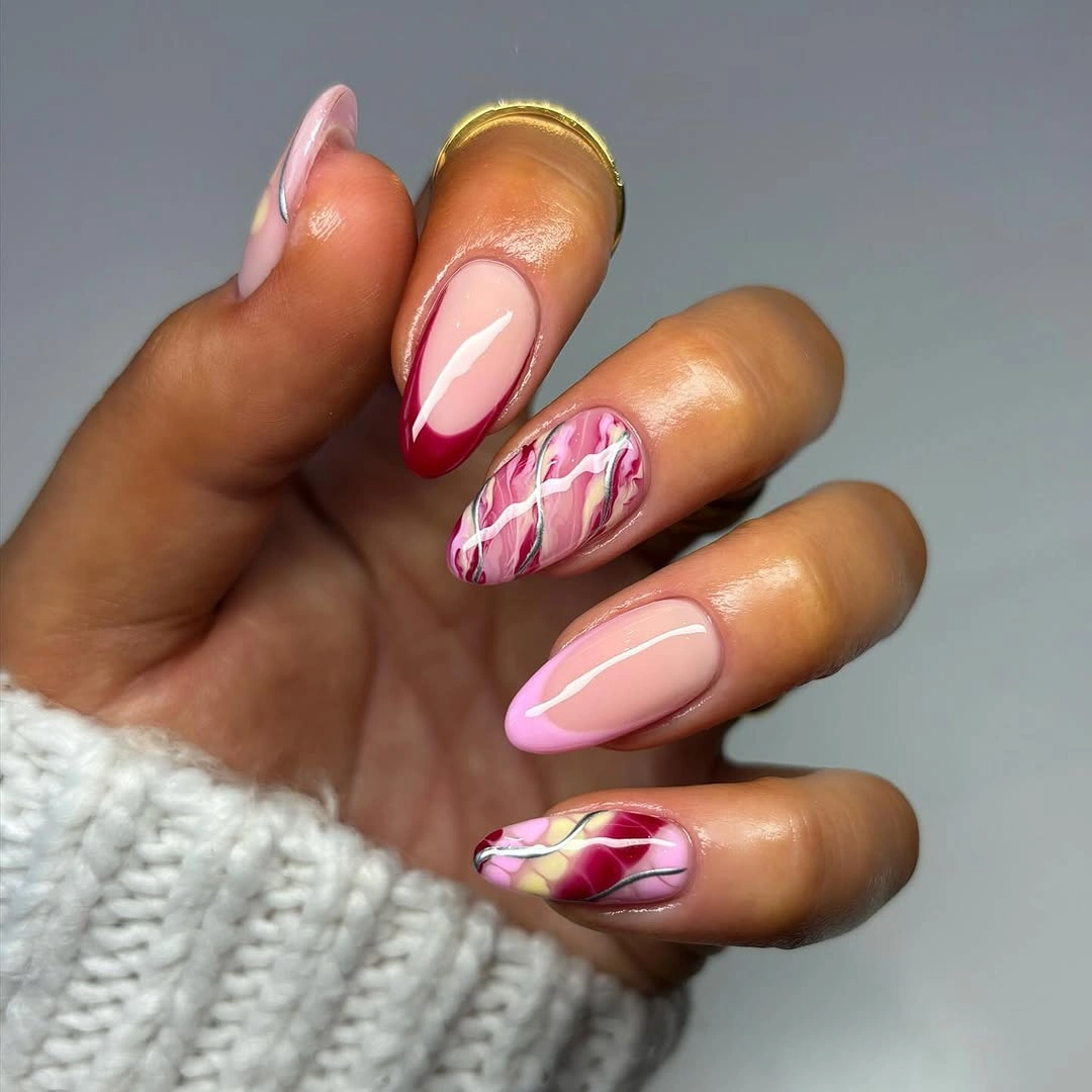 Pink cranberry almond nails with marble accents