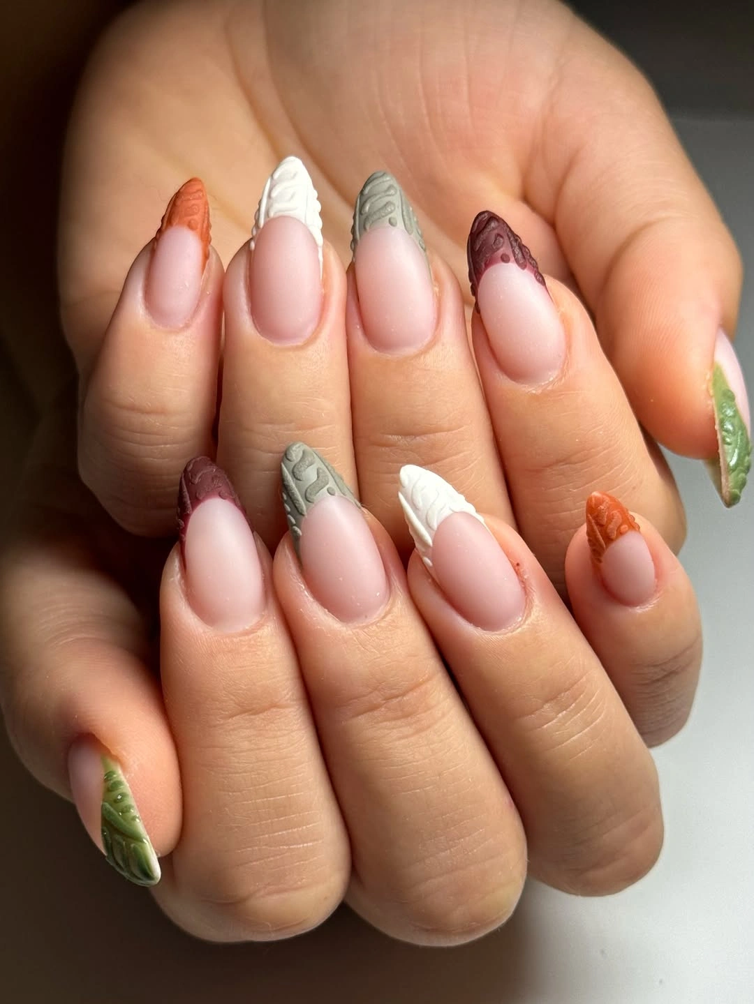 Textured autumn French tips on almond nails