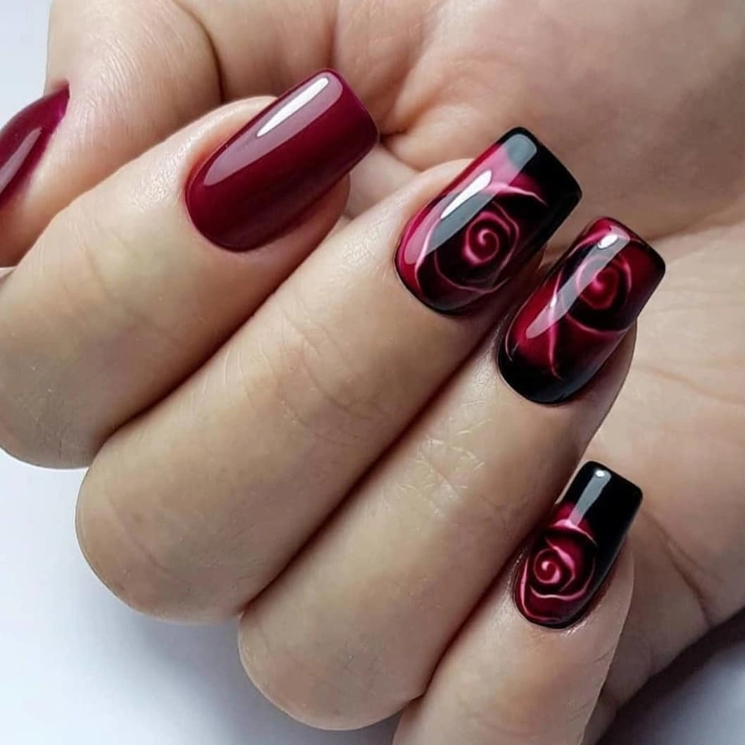burgundy square nails with swirl accents