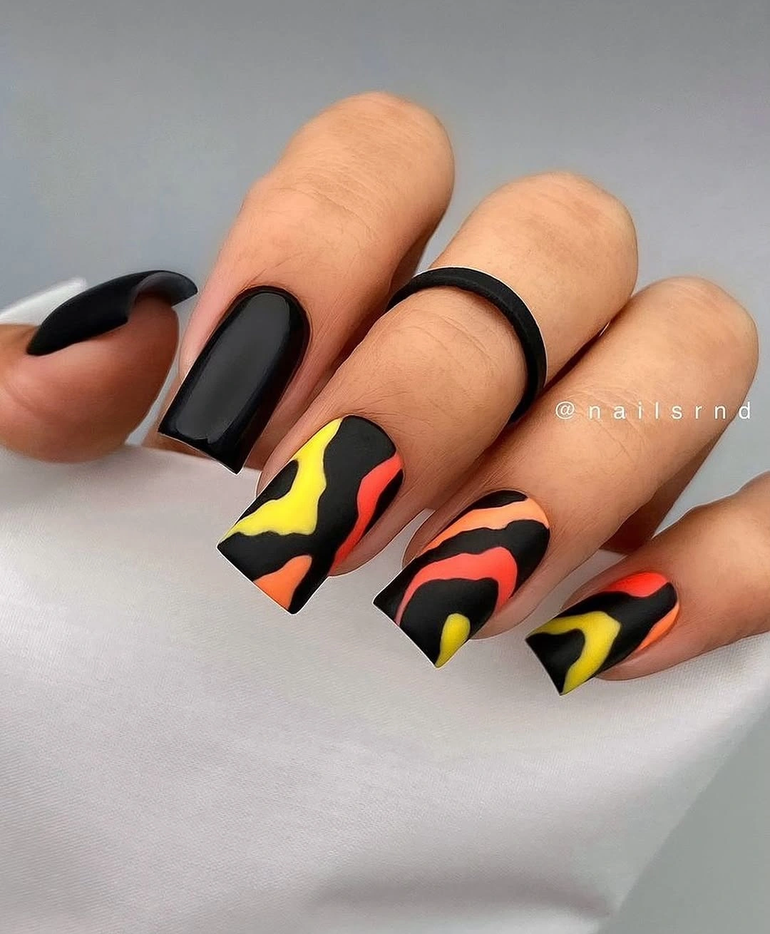 nude coffin nails with orange glitter panels