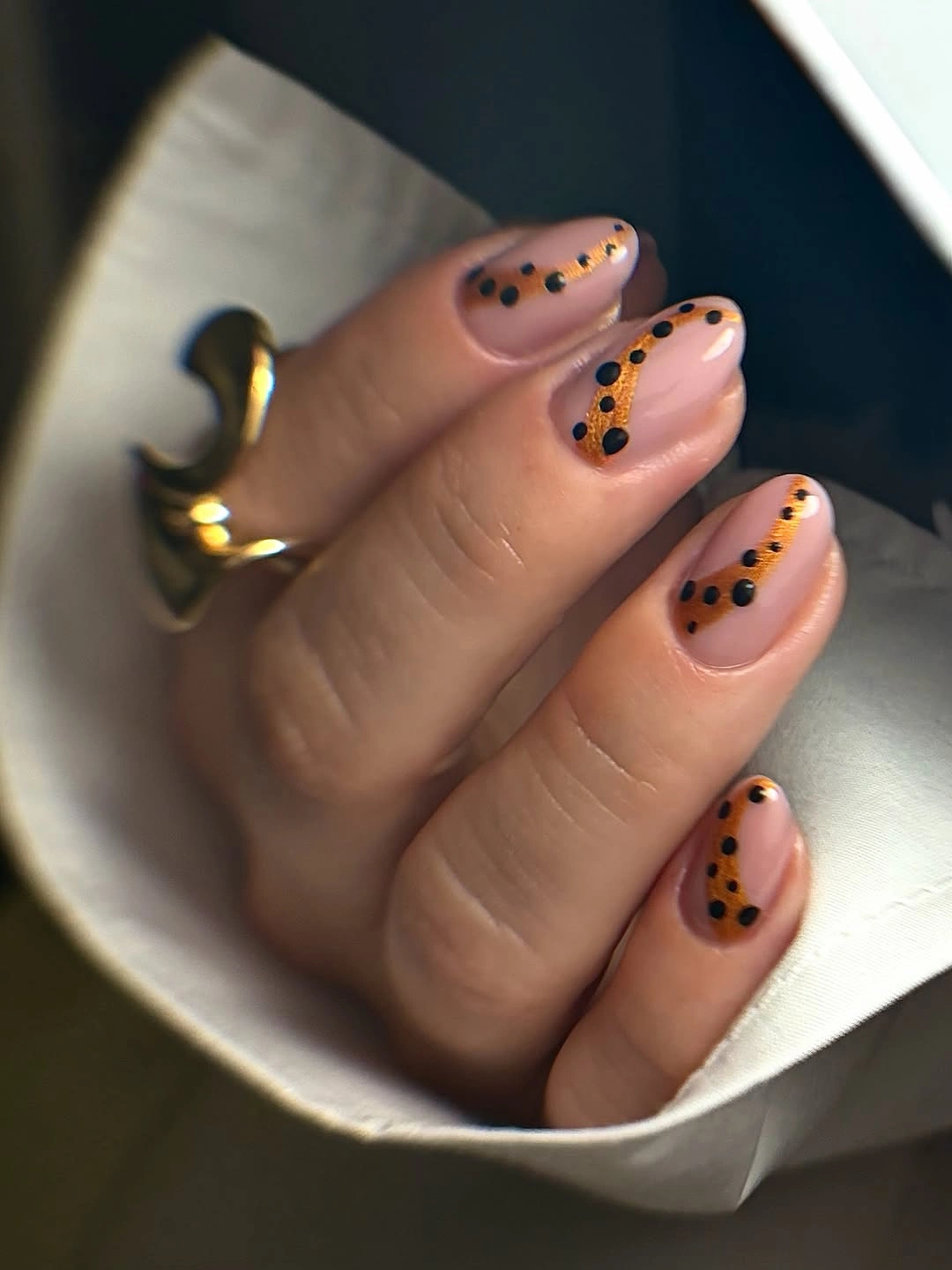 pale pink rounded nails with black dot borders