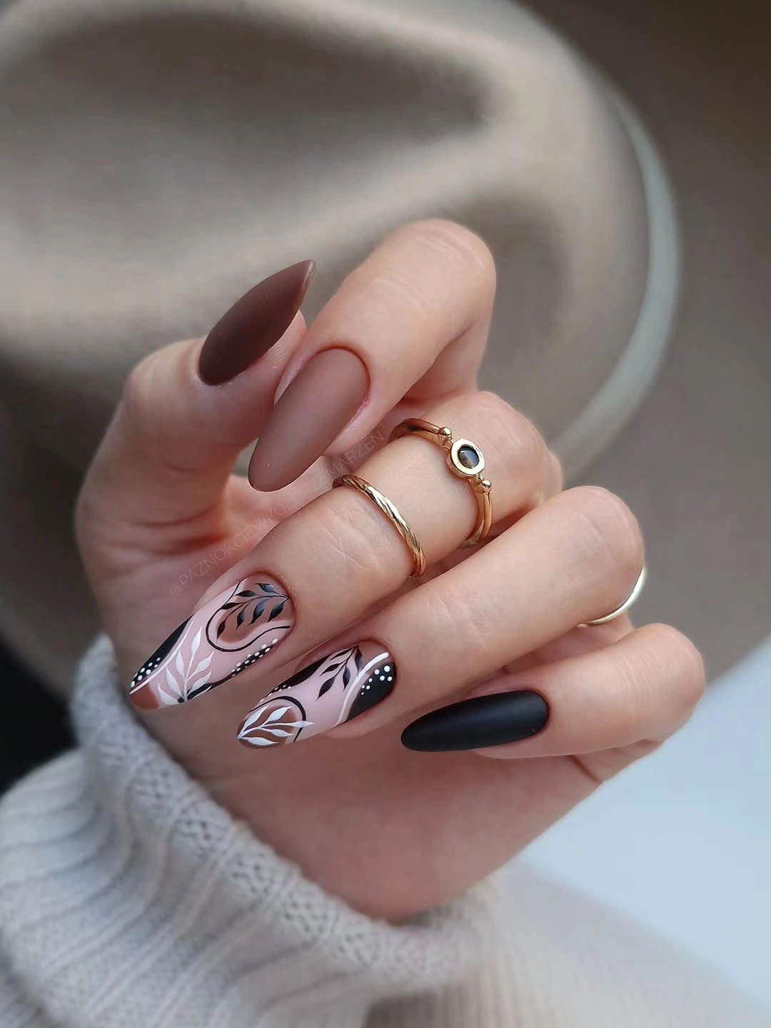 blush almond nails with botanical line art