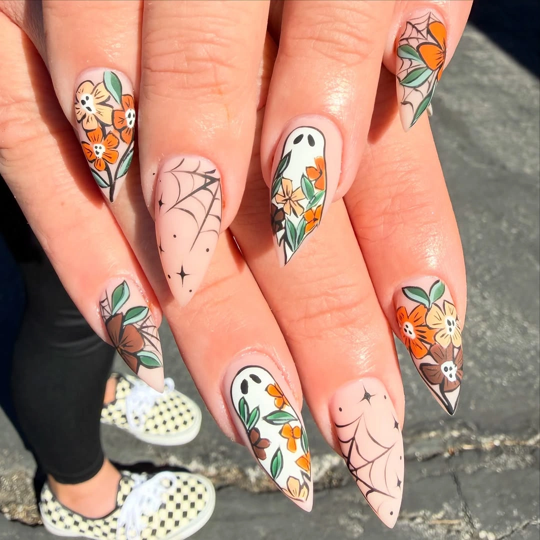 white orange almond nails with leaf details