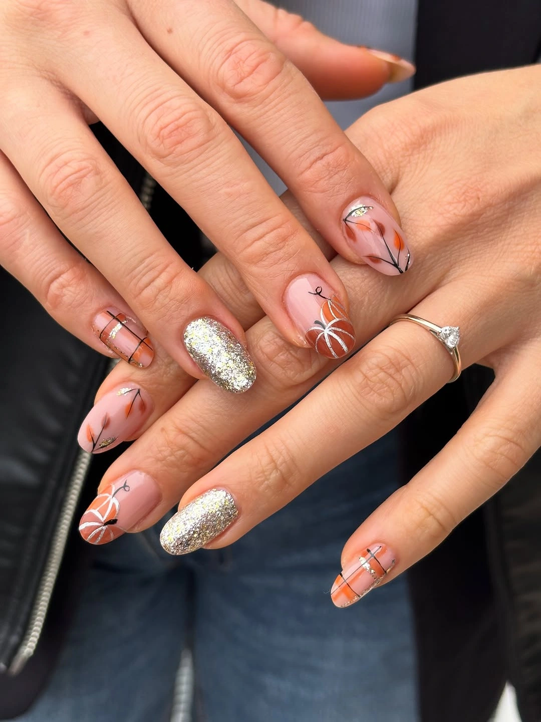 blush orange almond nails with silver accent