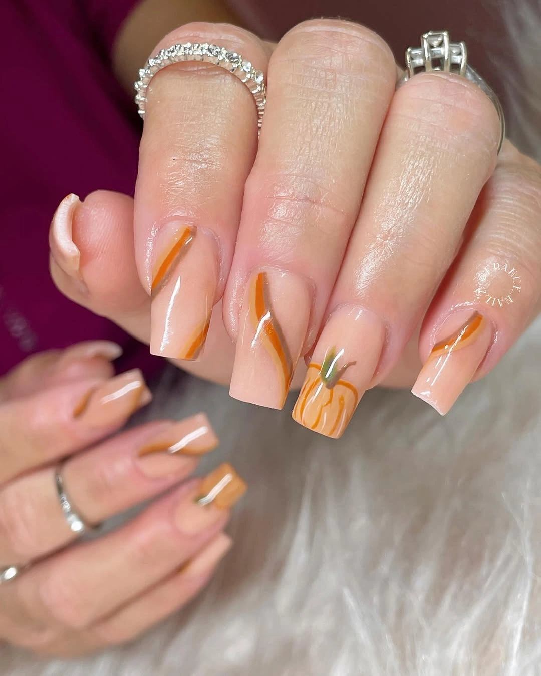 pale pink coffin nails with orange pumpkin tips