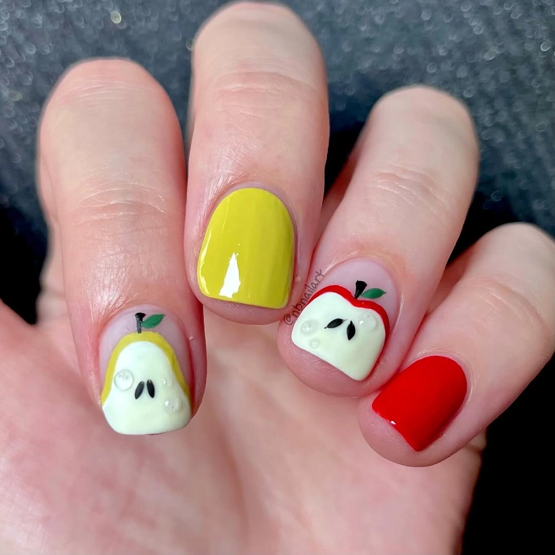 Short square nails with red and yellow apple accents
