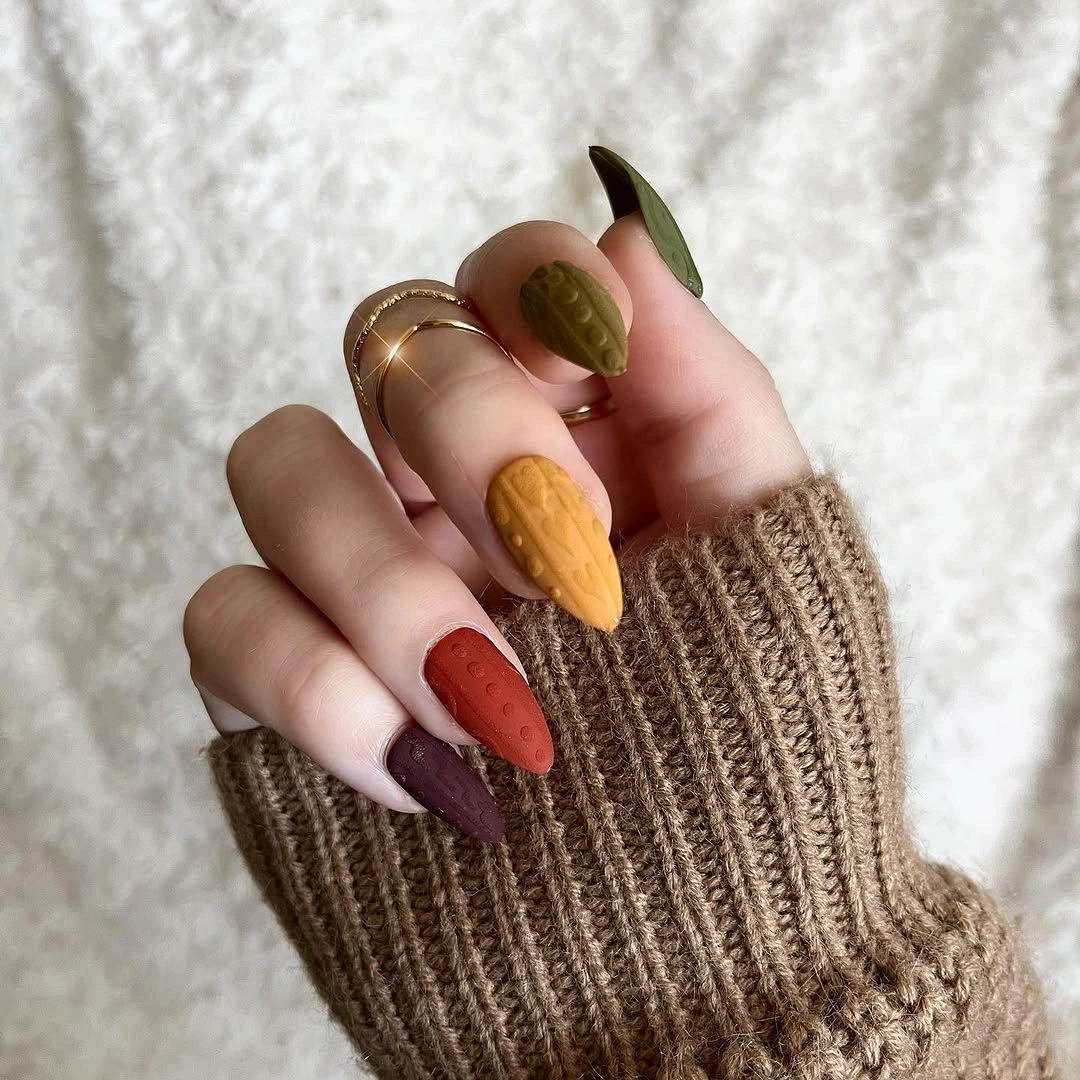 Short to medium nails in olive mustard rust plum and brown shades