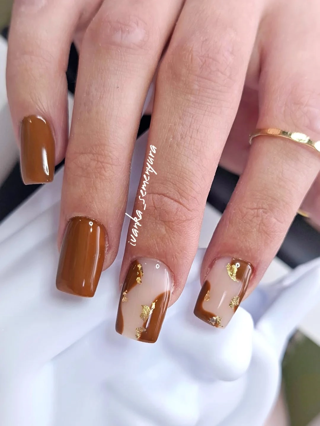 Brown square nails with sheer nude and gold accents