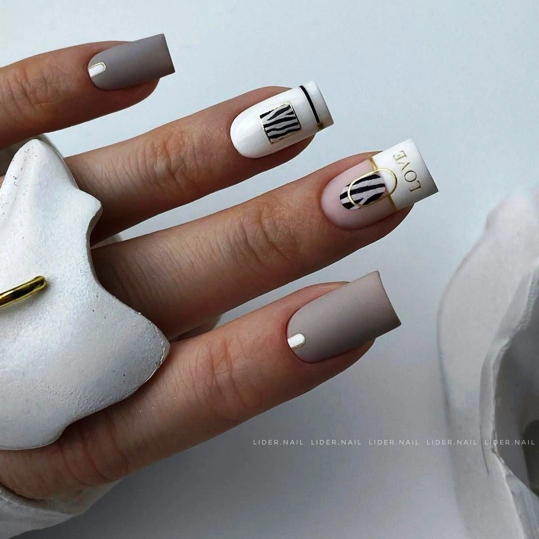 Taupe square nails with black lines and white dots