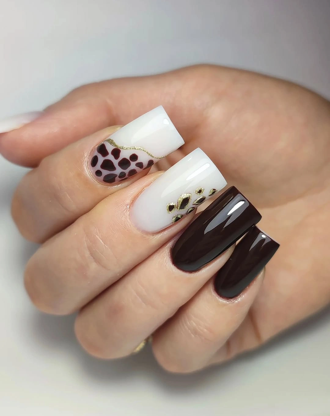 Brown white and black square nails with graphic blocks