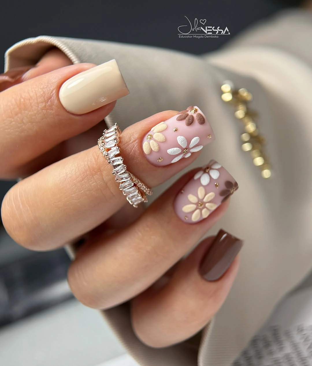Short cream coffin nails with raised brown floral details