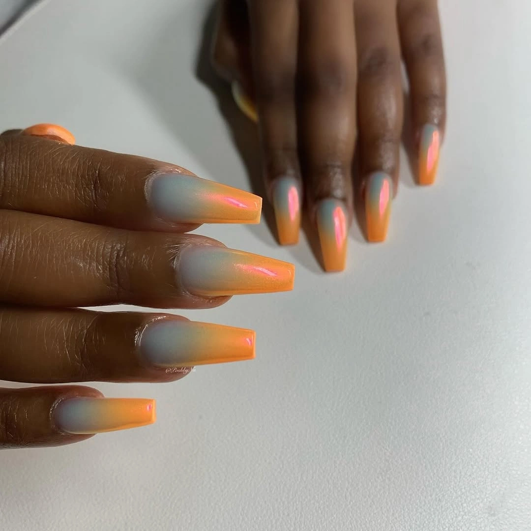 Long square nails with smoky blue and bright orange edges