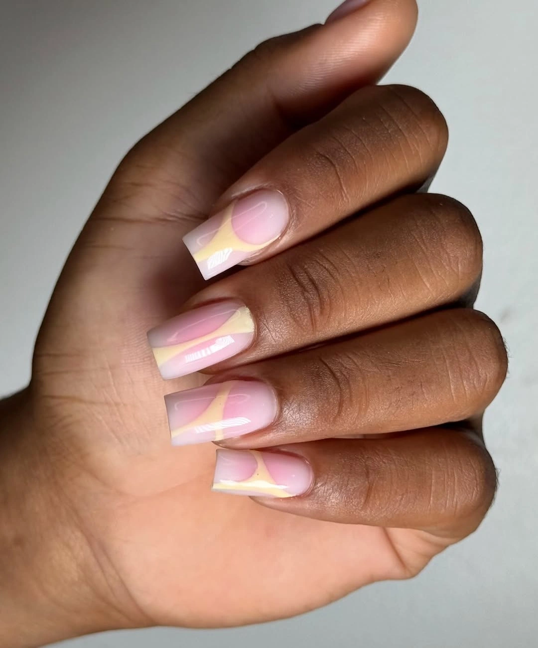 short pink nails with crisp white French tips