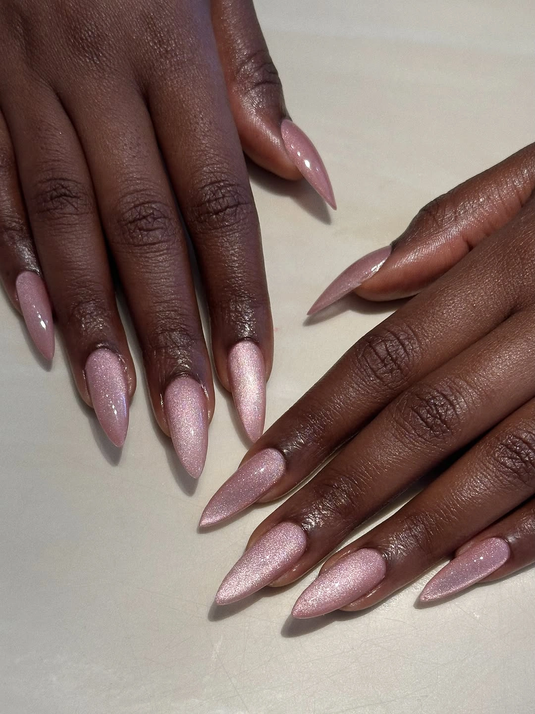 long pointed nails in translucent pale pink