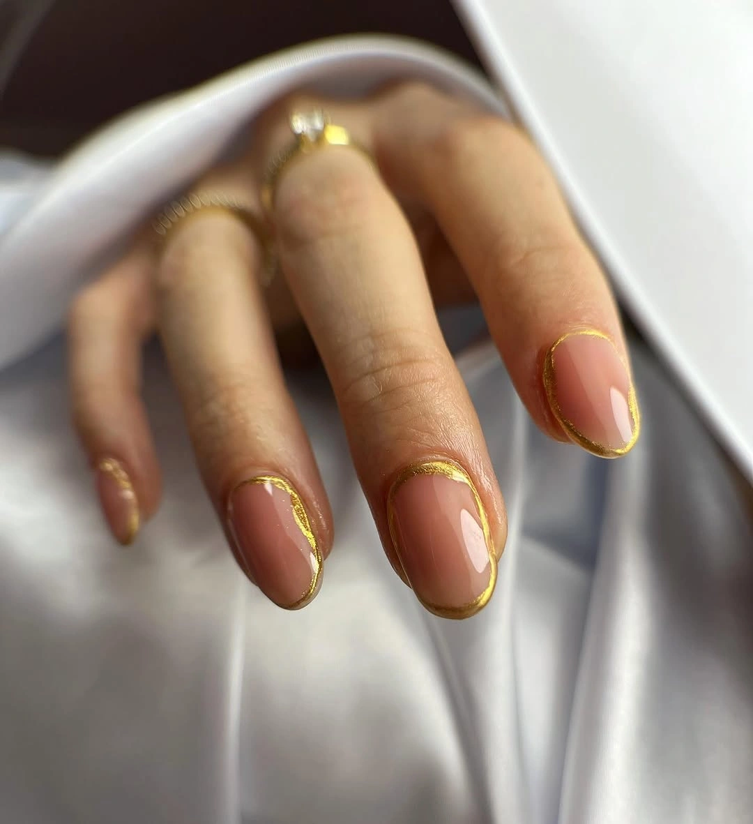 long almond pale pink nails with delicate shimmer