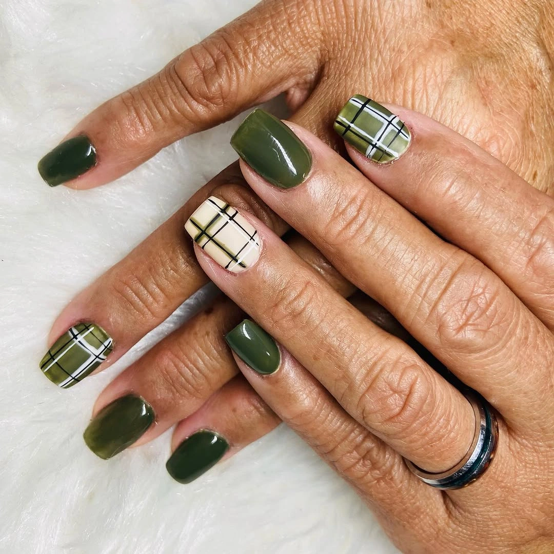 Short square olive green nails with cream plaid and dark line accents