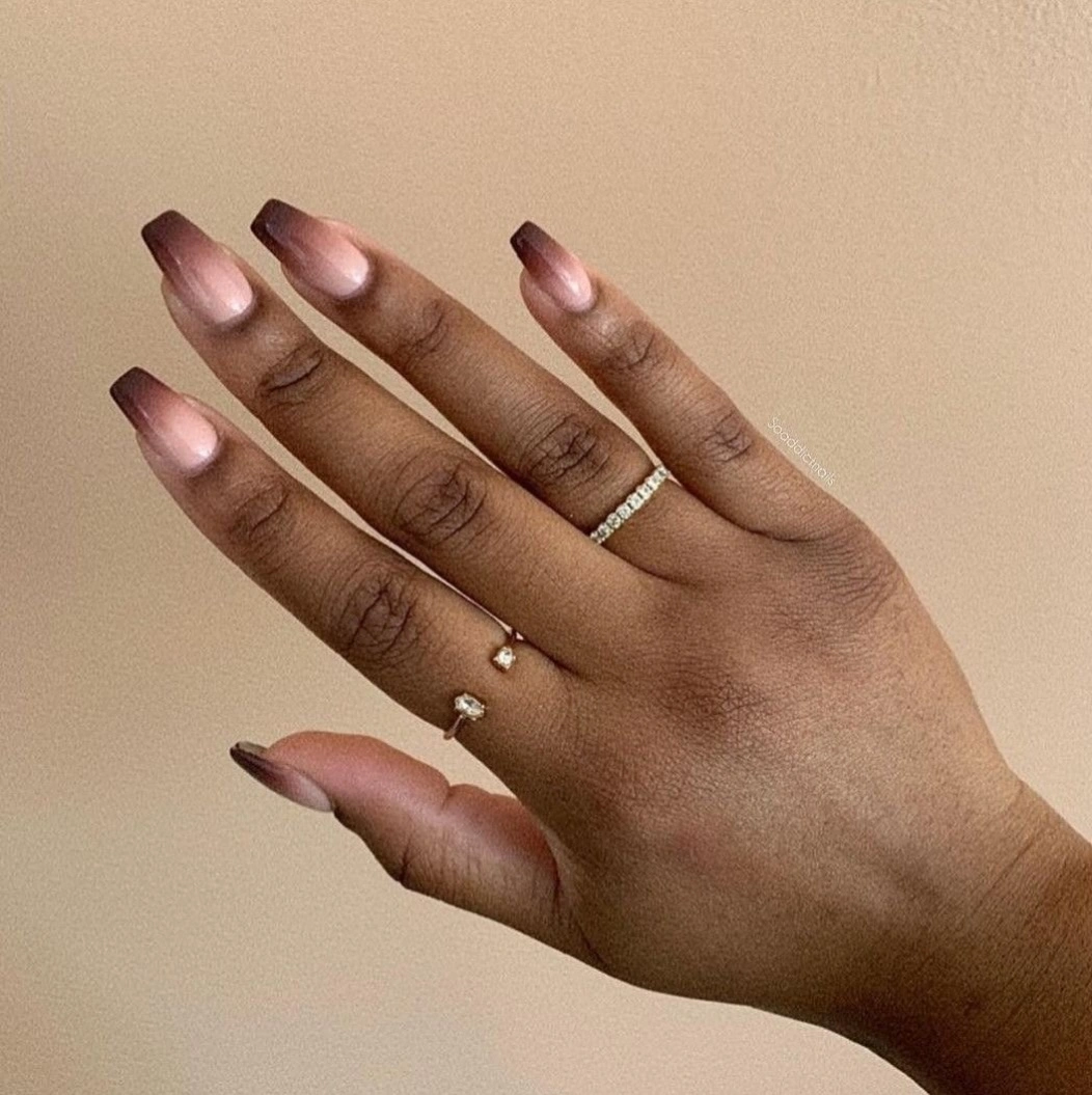 Medium almond nails with a soft muted mauve and brown gradient