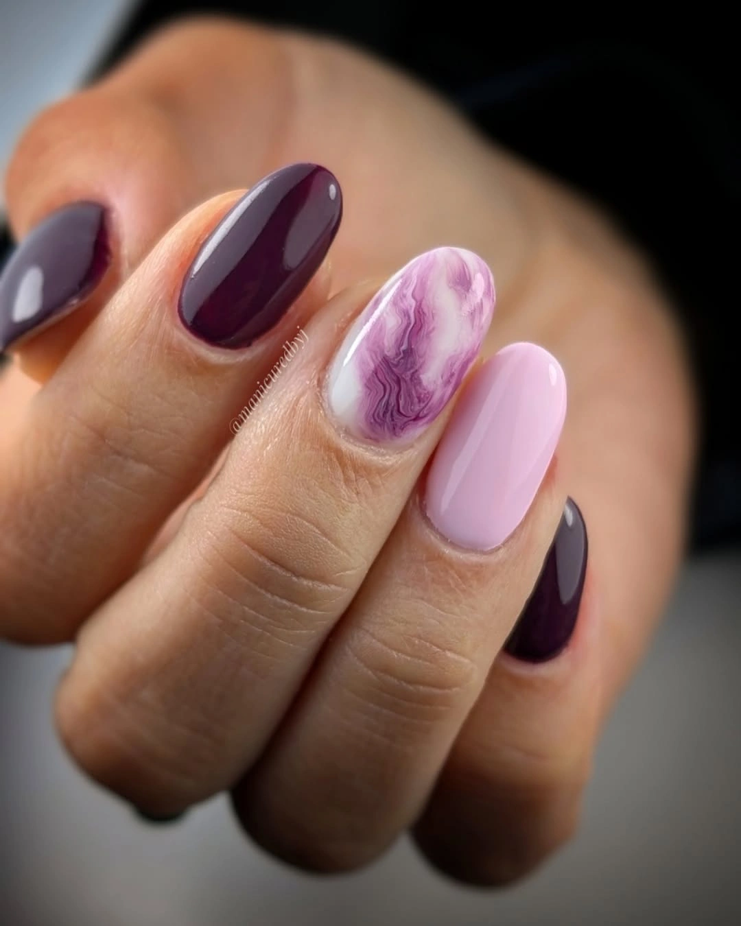 Short plum and pink nails with purple marble accent