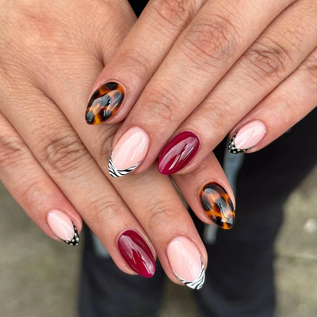 Almond pink burgundy tortoise and zebra French tip nails