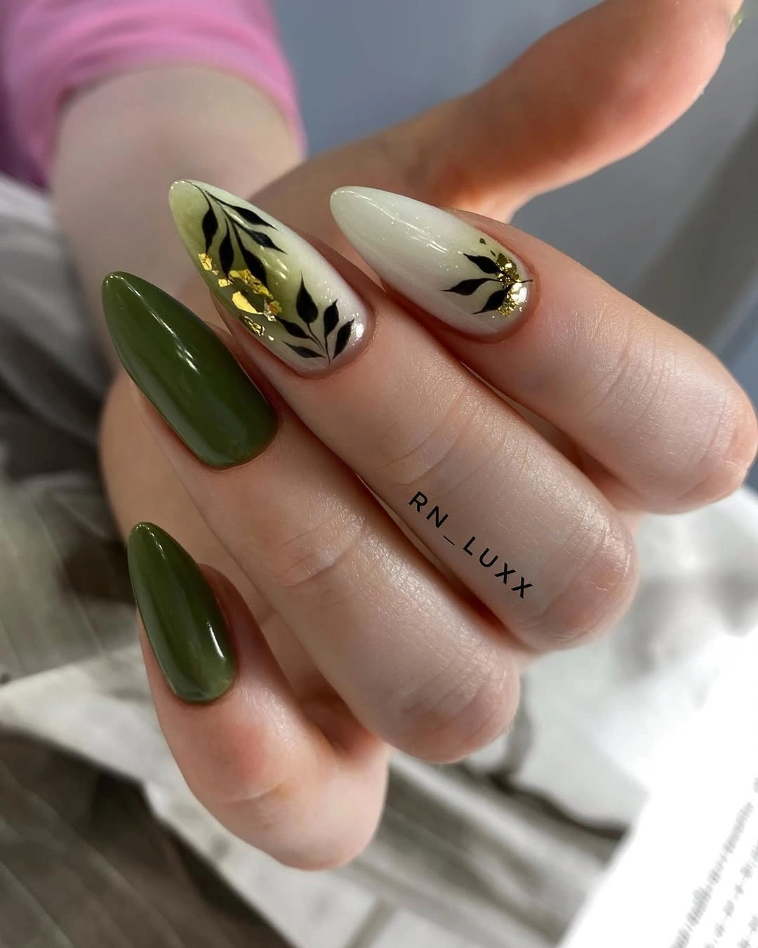 Medium olive almond nails with cream botanical leaf accents