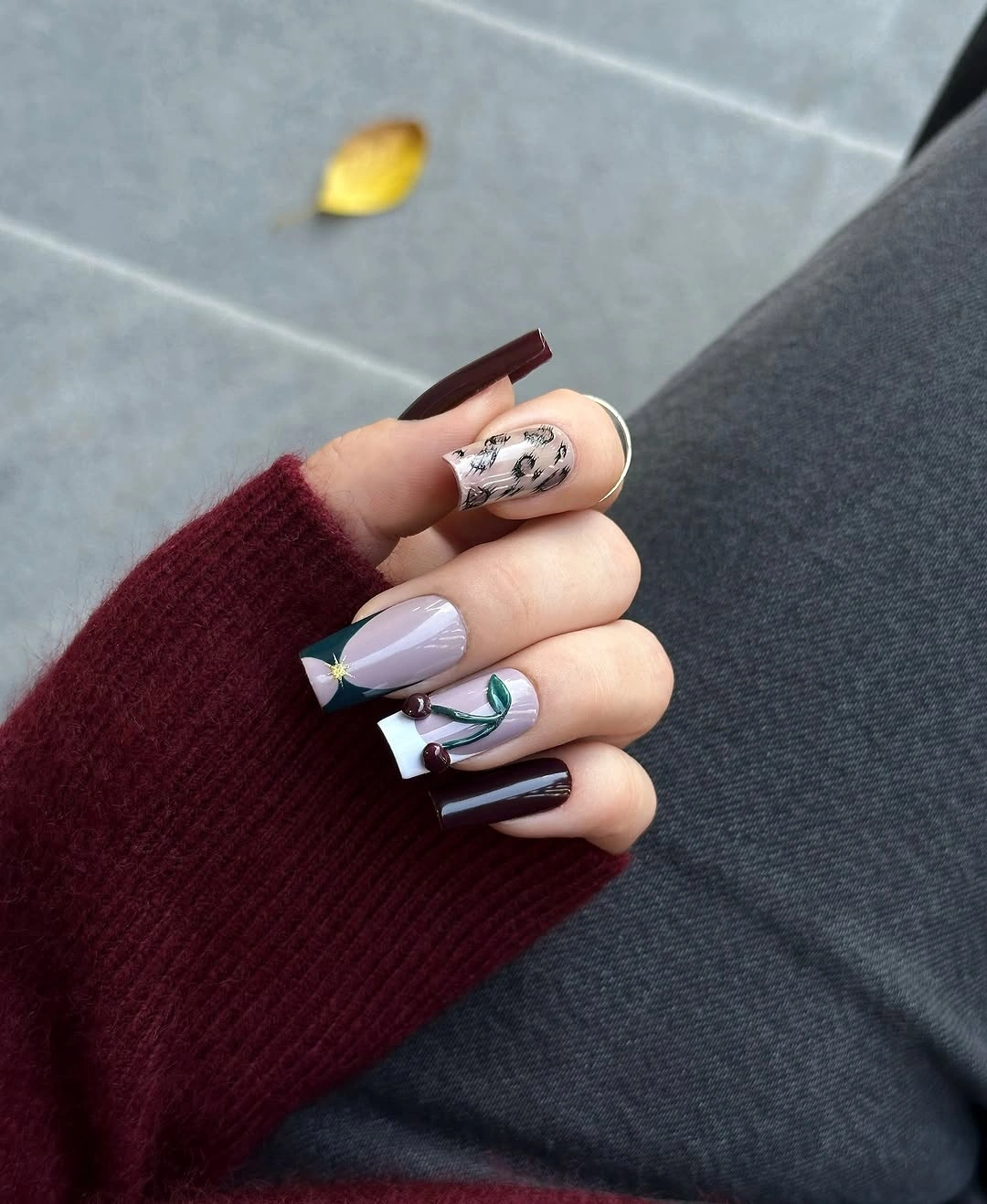Mixed burgundy lilac and pale nails with small linework accents