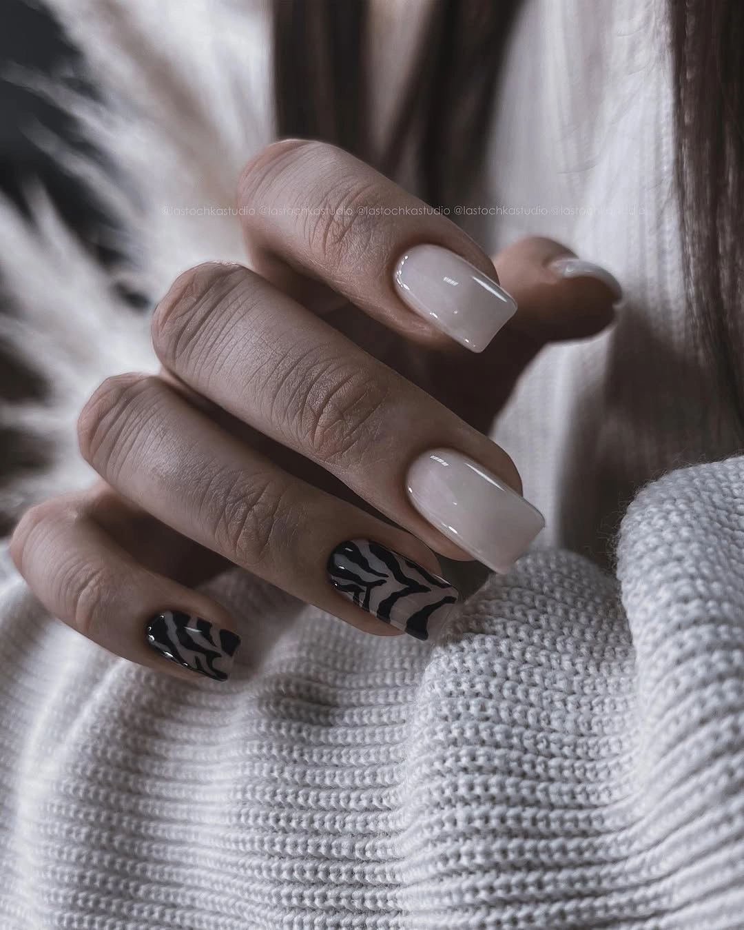 Short milky square nails with black abstract leaf accents