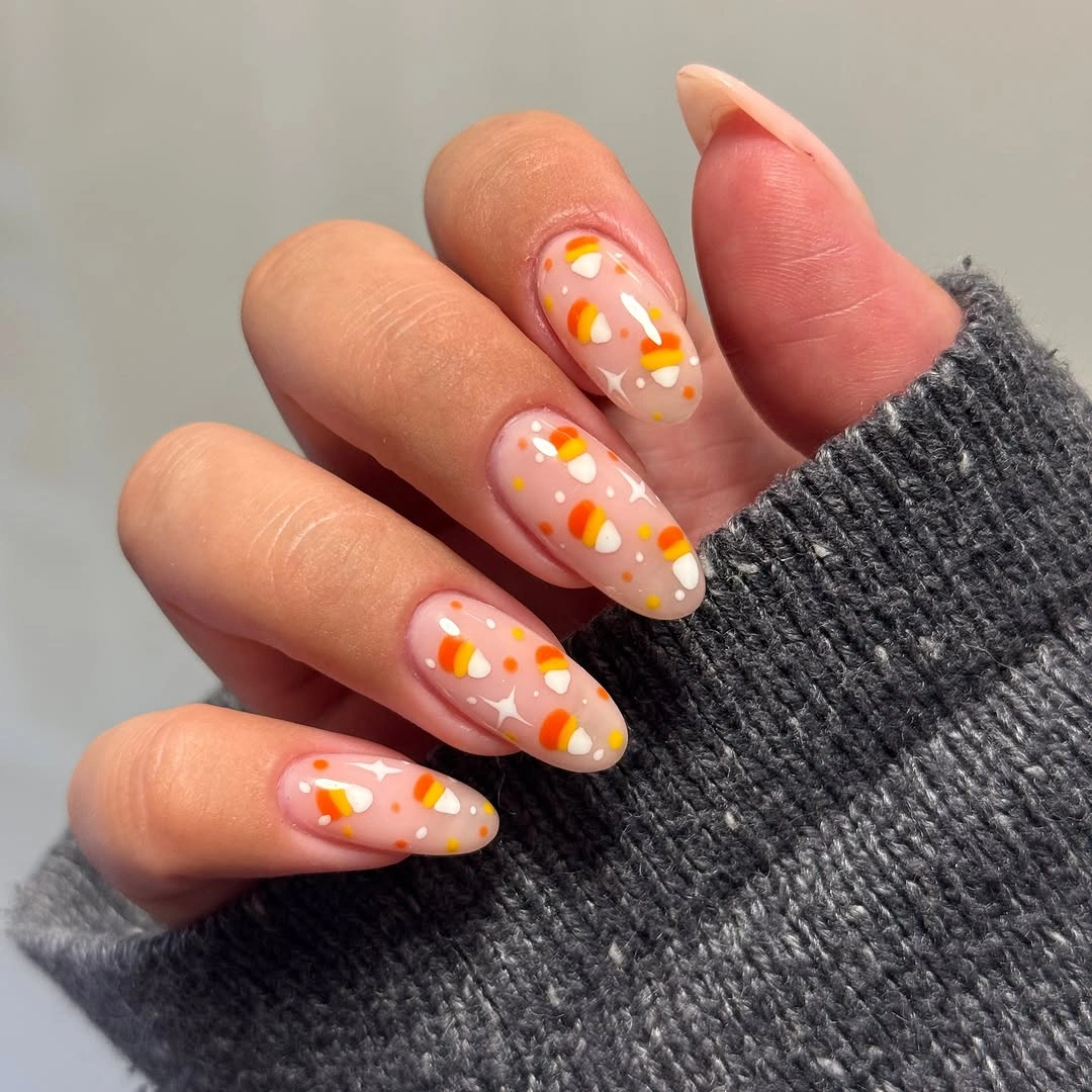 Milky pink almond nails with orange yellow abstract floral art
