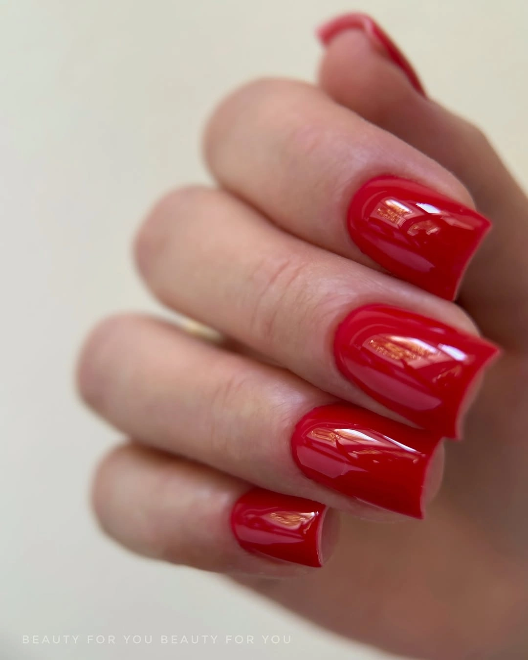 Short rounded square nails in saturated glossy red