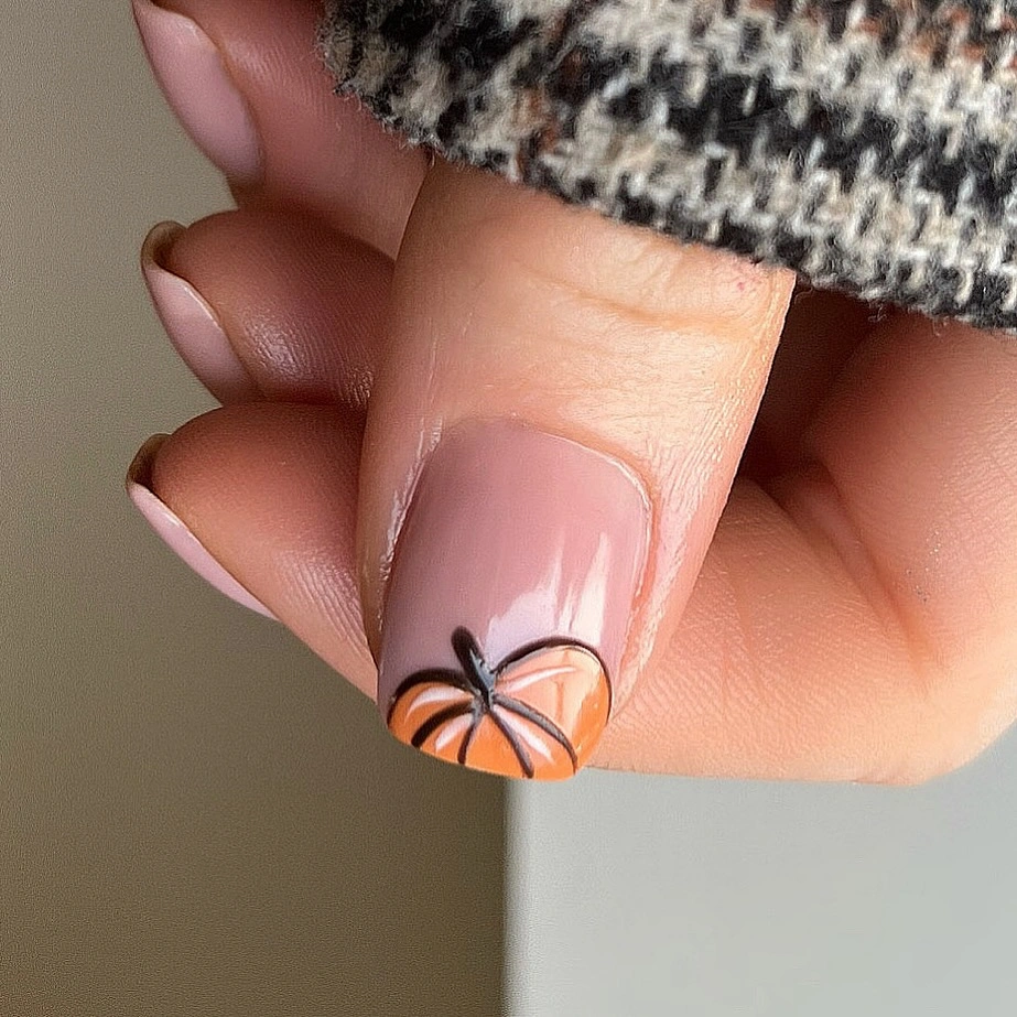 Short nude pink square nails with one small black outlined motif