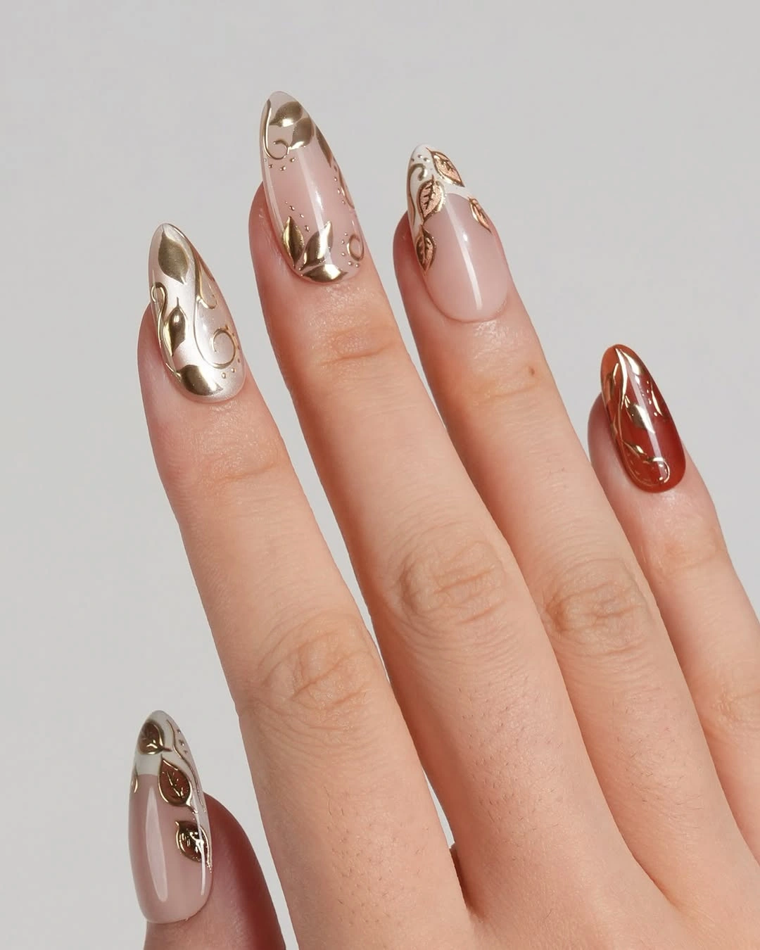 Long peach square nails with repeated orange and white lines
