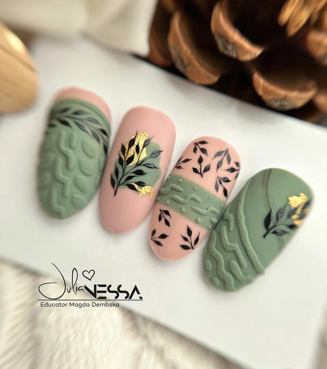 sage green almond nails with botanical accents