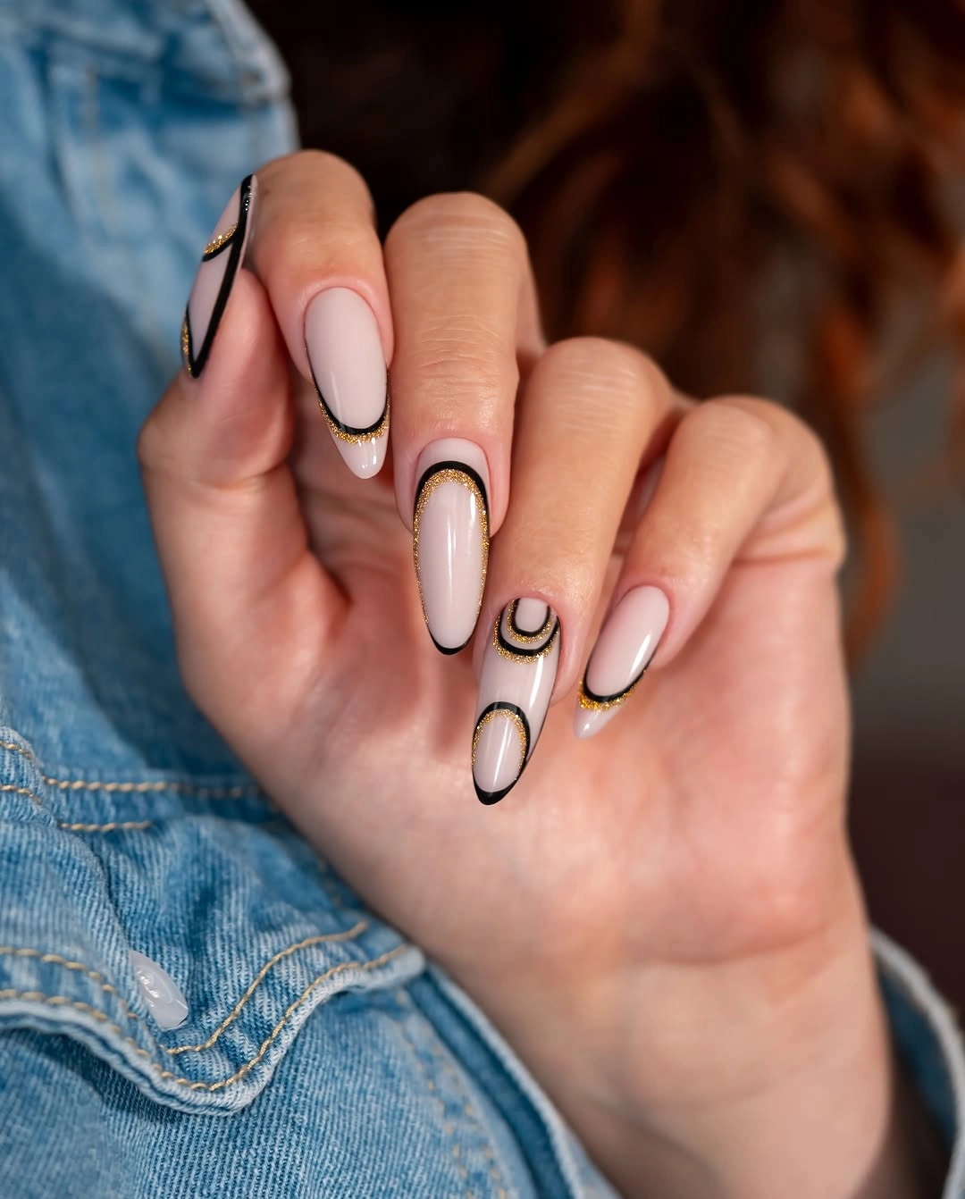 soft white almond nails with black curves