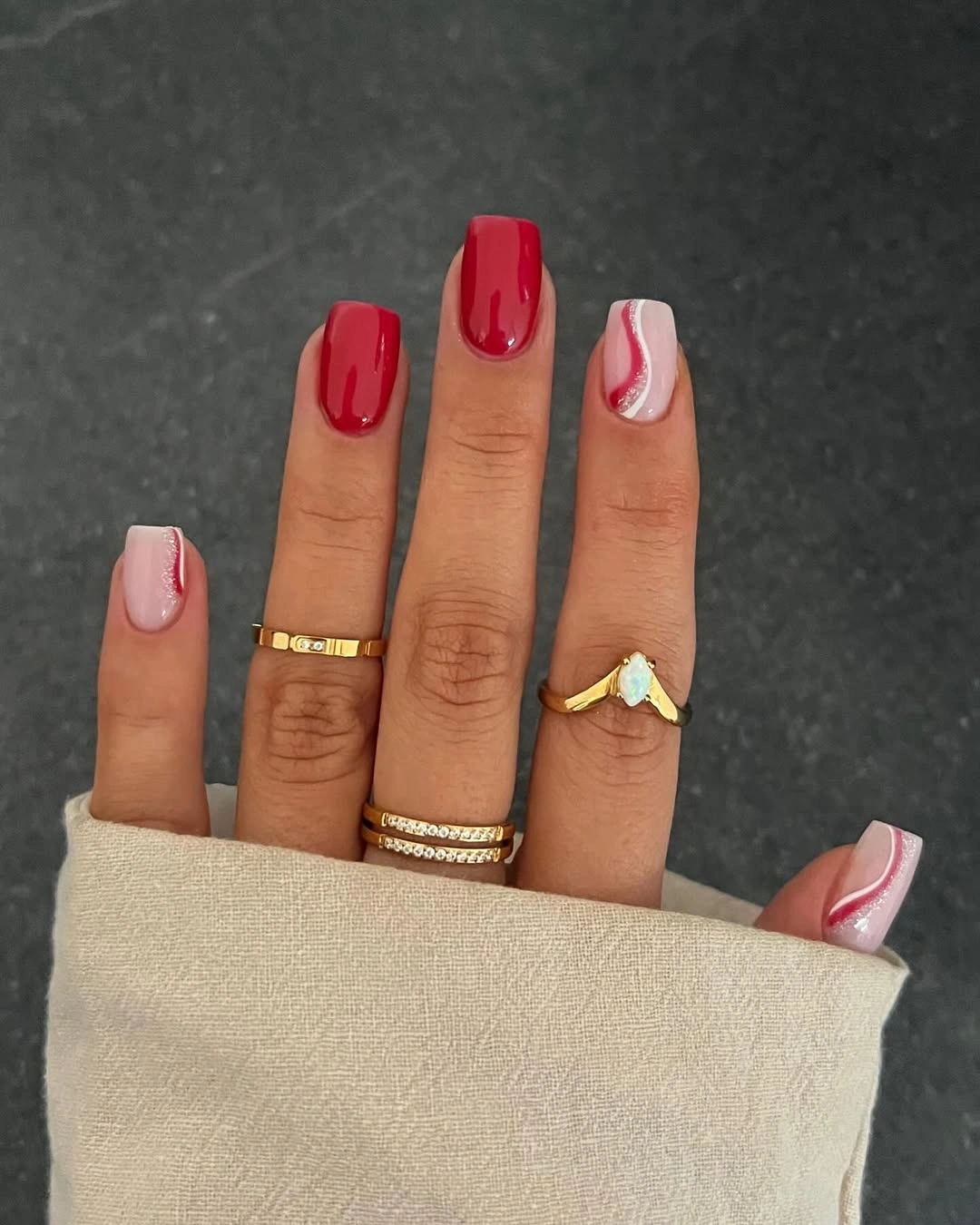 Short red nails with white wave accent