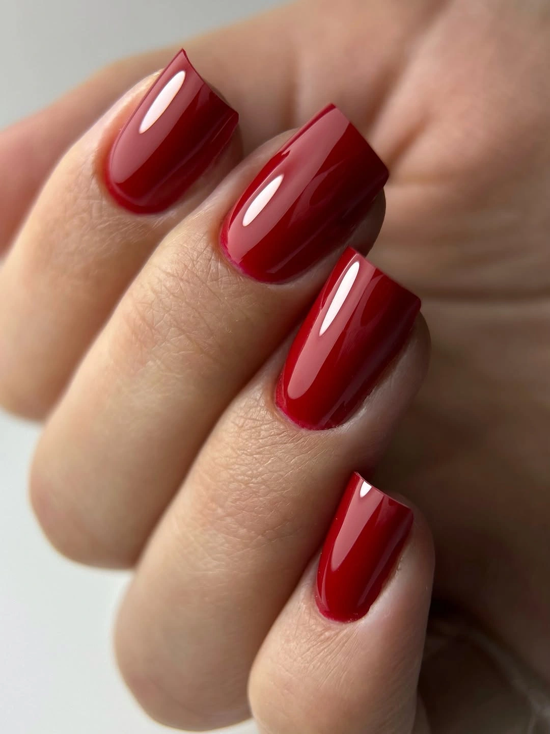Glossy bright red short square nails