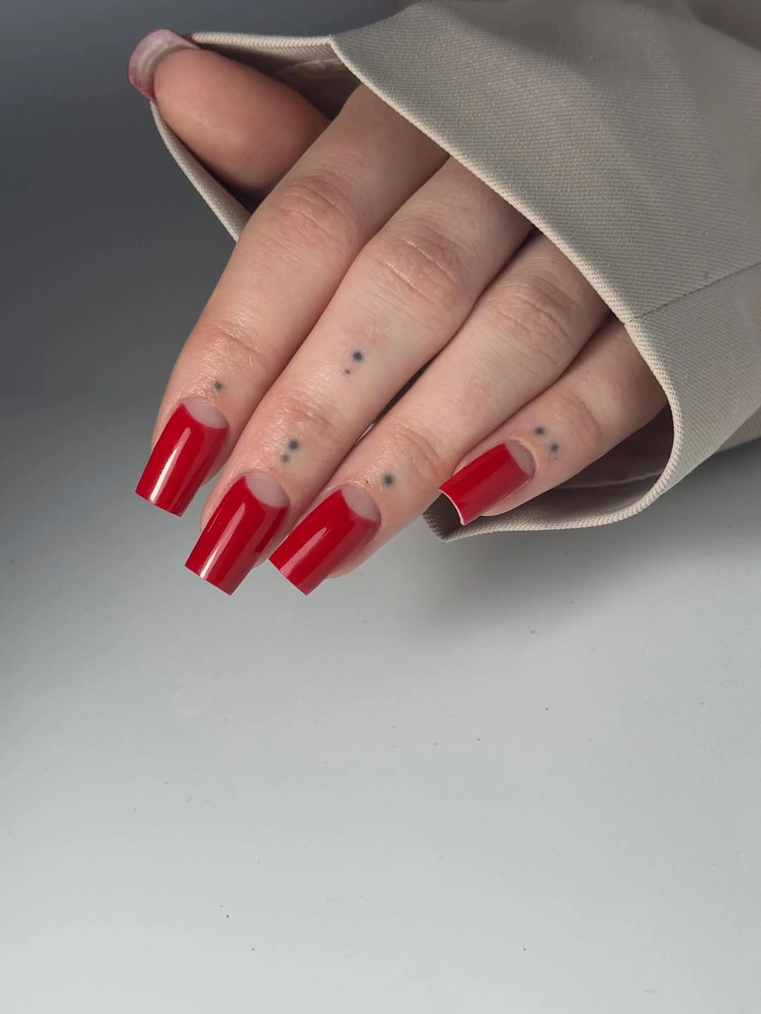 Long red square nails with clear half moons