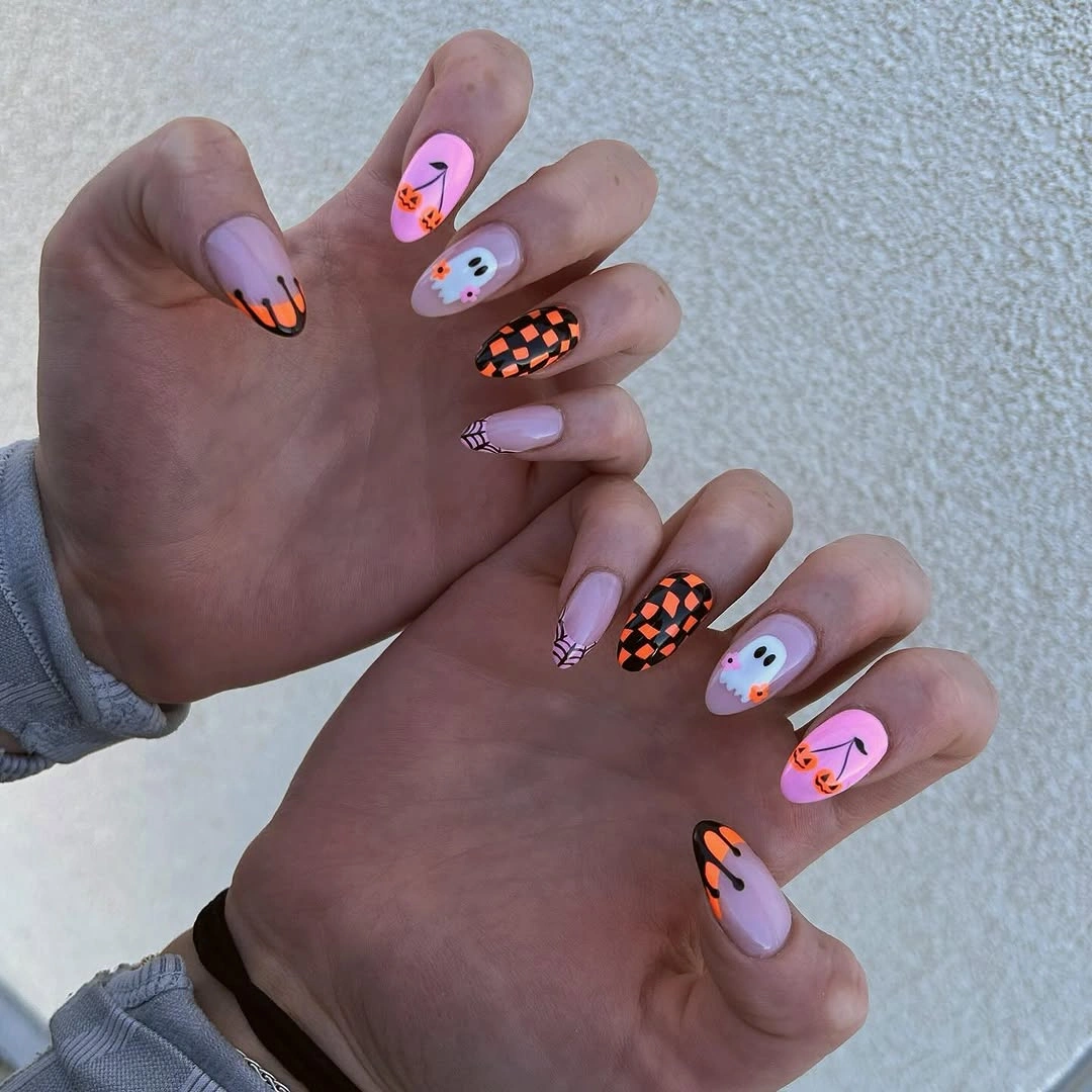 Medium almond lavender nails with orange black white and pink graphics