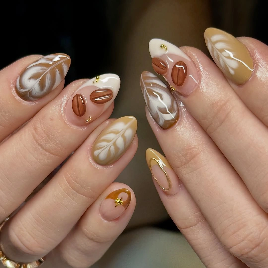 Short almond taupe cream and brown nails with abstract petal shapes