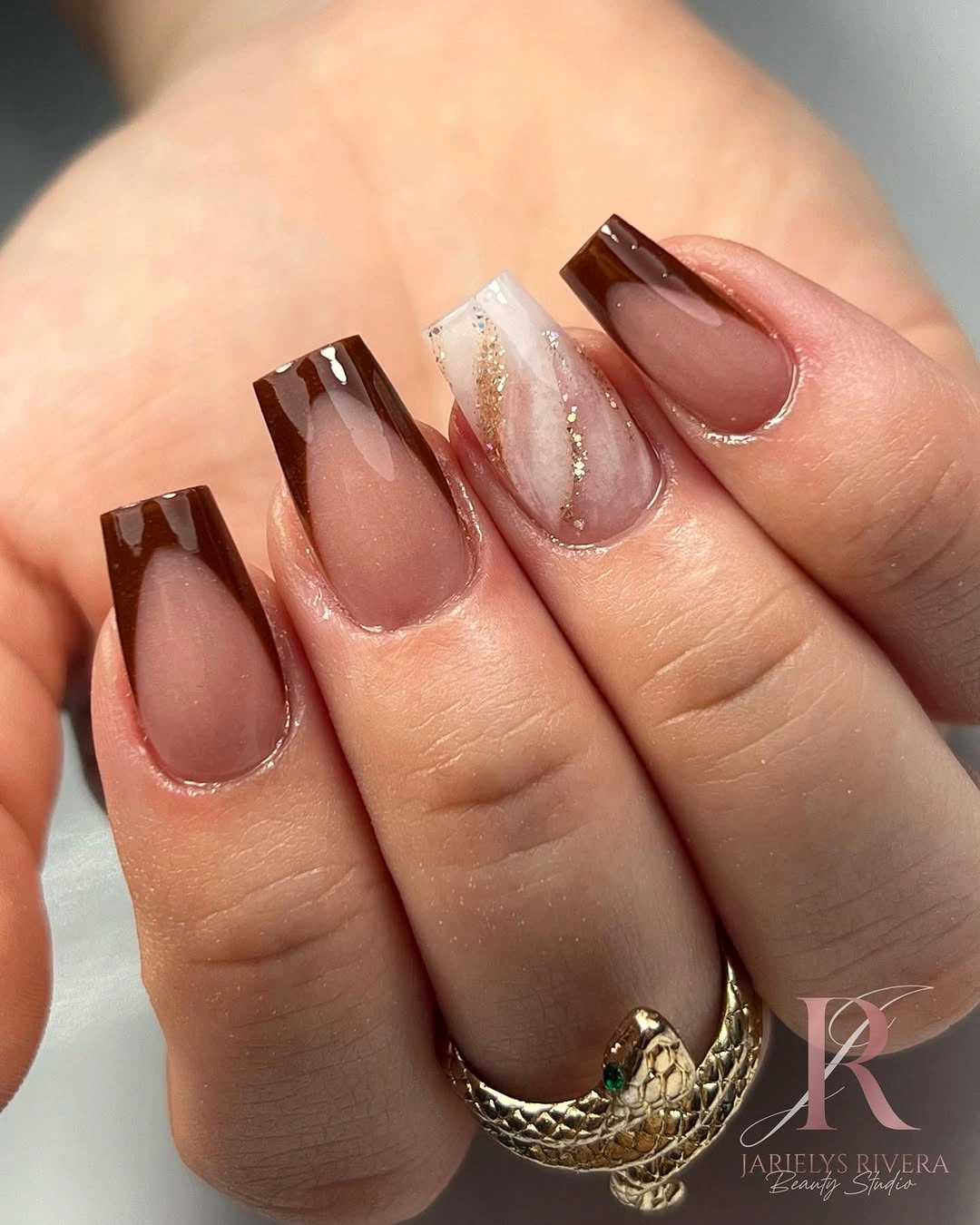 medium nude coffin nails with chocolate accents and pale glitter